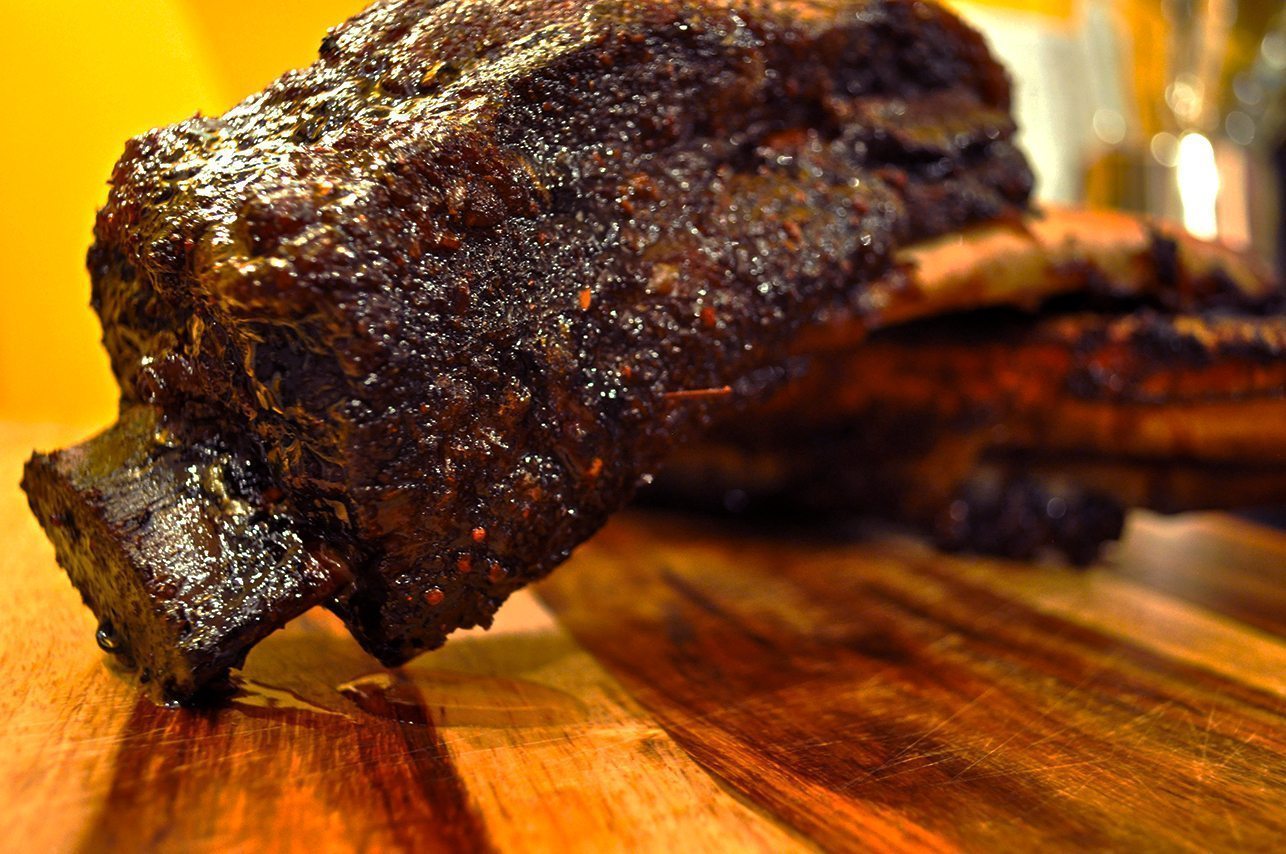 Smoked beef short ribs on cutting board