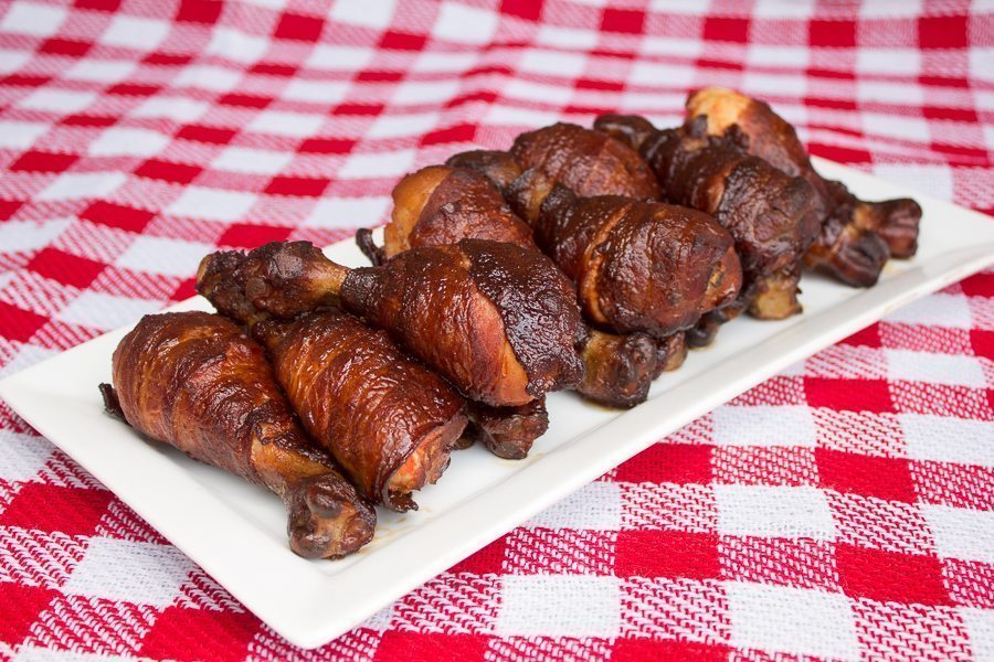 Cave man clubs smoked drumstick wrapped in bacon